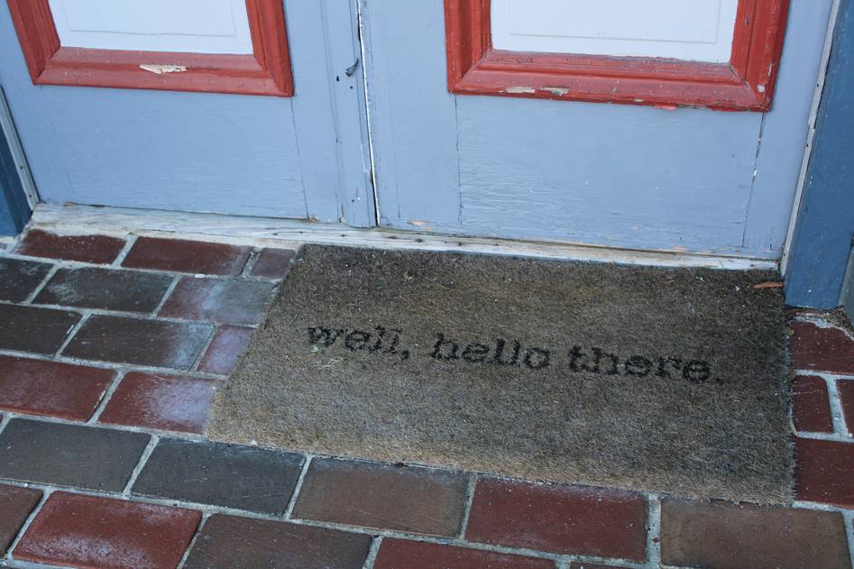 Cozy doormat collection displayed on a rustic wooden floor