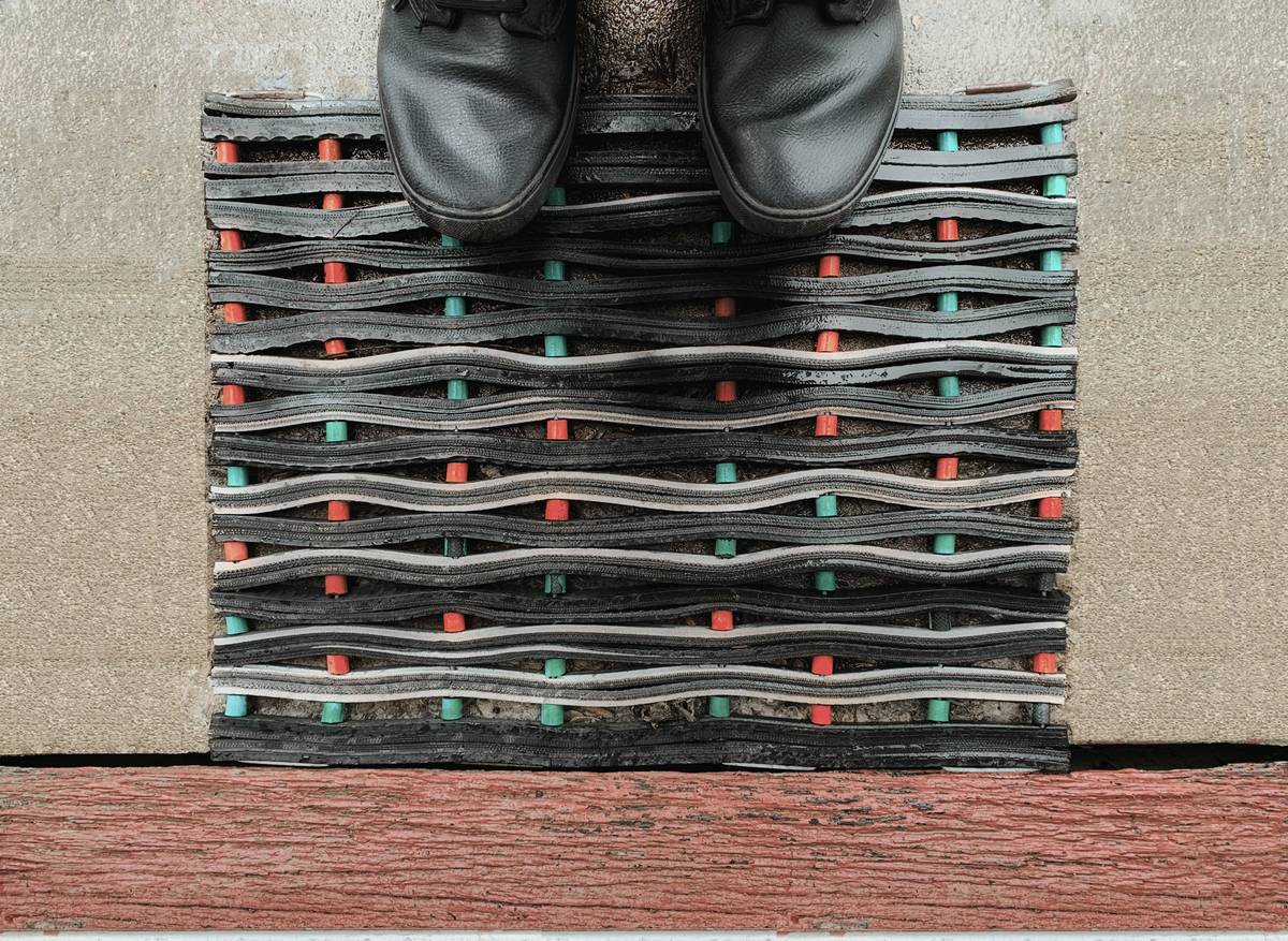 An Old-fashioned Black Rubber Door Mat