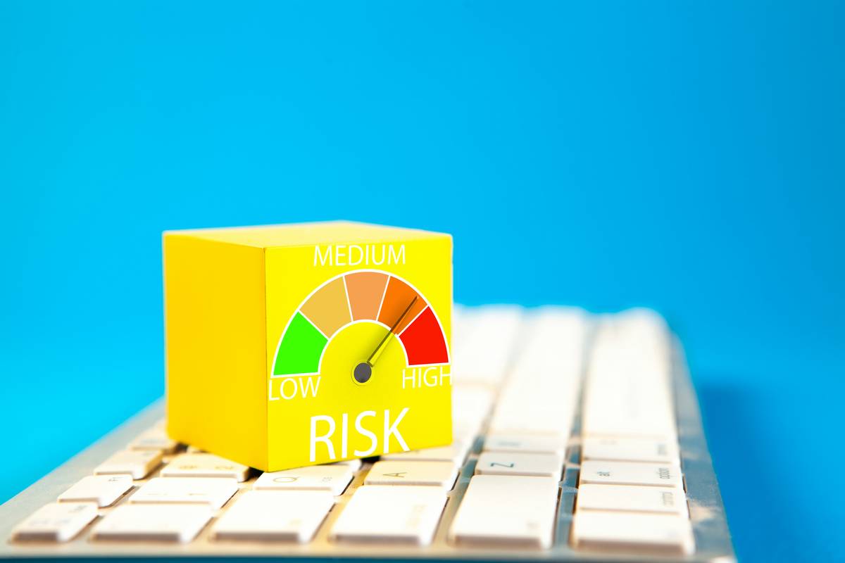 Colorful graph on a computer keyboard with the word Low Risk.
